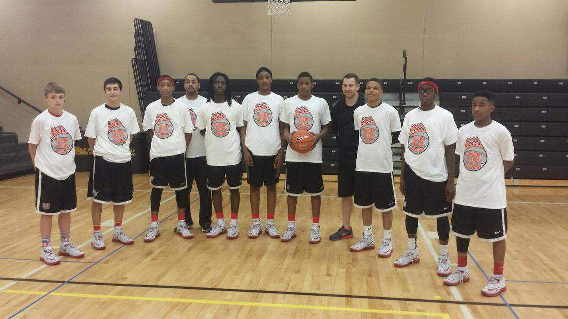 The 2014 Mokan seventh grade team included Christian Braun (far left), Dajuan Harris Jr. (third from left in red headband) and Isiaih Mosley (sixth from left in black headband).