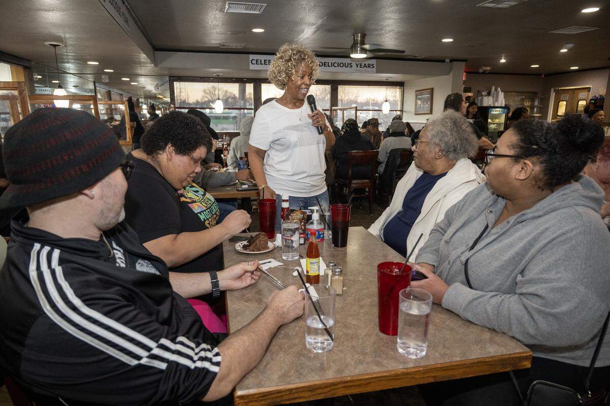 Denise “Ms. Niecie” Ward greets customers in the restaurant as performs old-school hits during “Dinner & A Show” at Niecie's Restaurant in Kansas City on Friday, Feb. 6, 2026. Ward performs on the First Friday of every month at her soul food restaurant.
