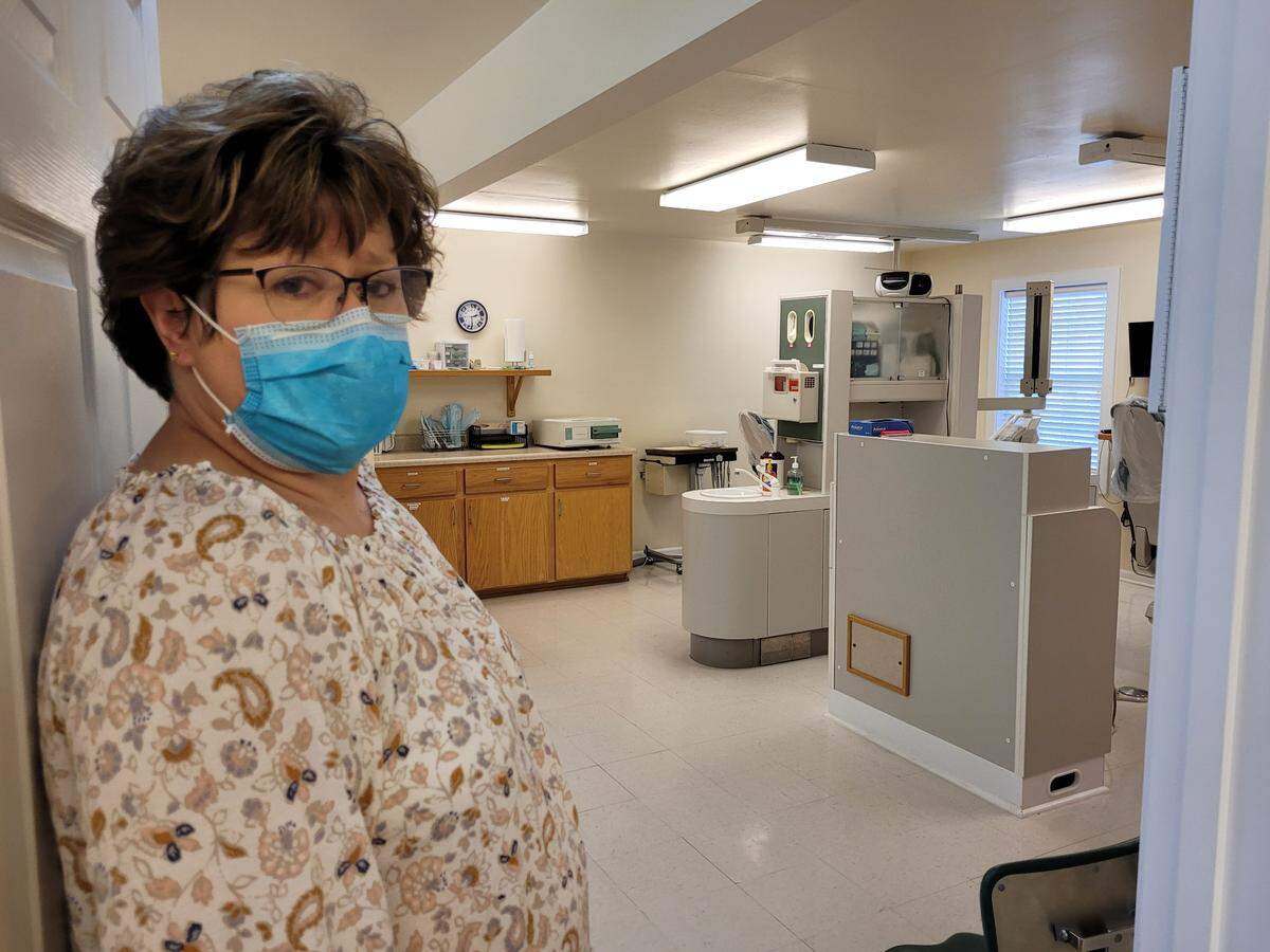 Clinic administrator Sheri Noble of the Good Samaritan Care Clinic shows a reporter the dental clinic at the free health care center in Mountain View, Mo. The clinic is preparing to close its doors and is urging its patients to apply for expanded Medicaid.