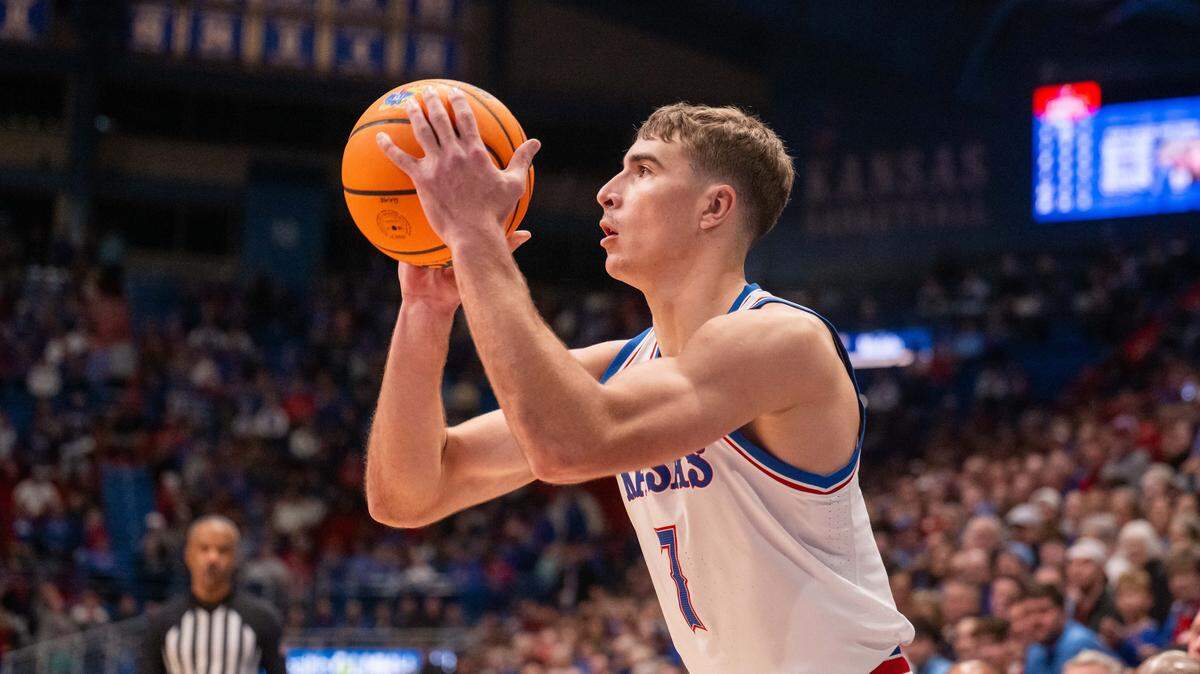 Kansas Jayhawks guard Kohl Rosario (7) shoots and makes a 3-pointer late in the second half vs. the Towson Tigers on Tuesday, December 16, 2025, at Allen Fieldhouse.