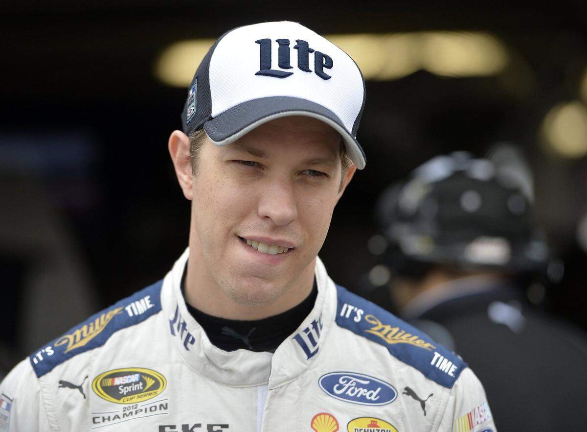Brad Keselowski is interviewed during a NASCAR Sprint Cup Series practice at Kansas Speedway.