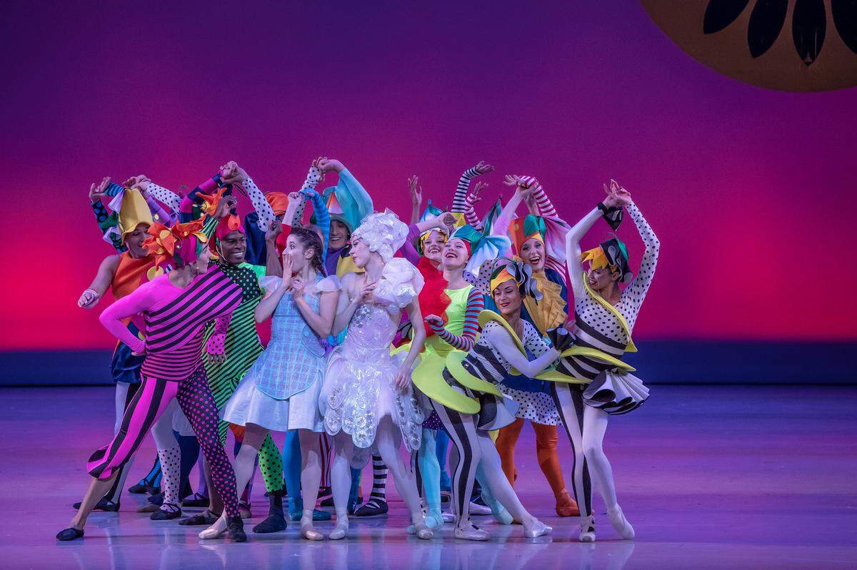 Dorothy gets a hearty welcome from the Munchkins in the Kansas City Ballet production of “The Wizard of Oz.”
