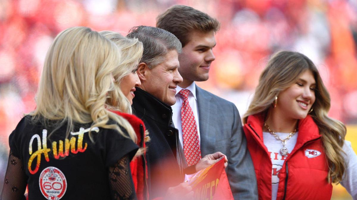 Kansas City Chiefs owner Clark Hunt, third from left, poses for photos with his family before the AFC Championship game Sunday, January 30, 2022, at Arrowhead Stadium.