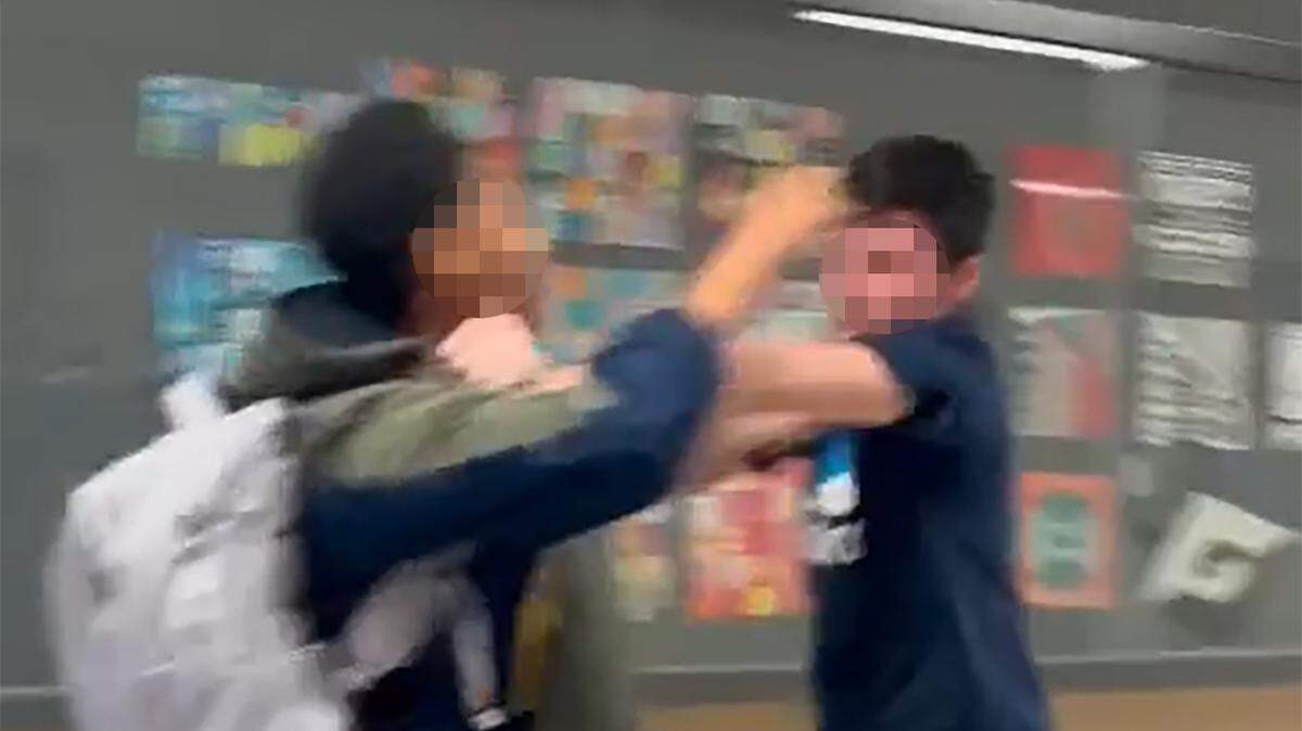 In this screengrab from provided video, a white boy shoved a Black girl student at Shawnee Mission East before the two fought.