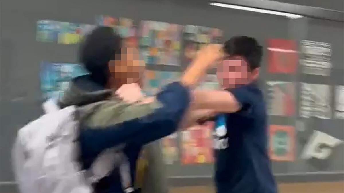 In this screengrab from provided video, a white boy shoved a Black girl student at Shawnee Mission East before the two fought.