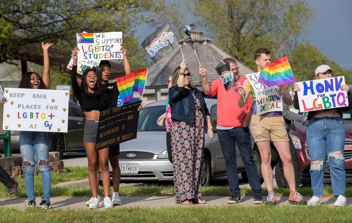 A crowd of more than 50 people attend a rally to support LGBTQ students in the Grain Valley school district Friday, April 29, 2022. District leaders recently made rules that forbid teachers from displaying any type of signs that show support for LGBTQ students.