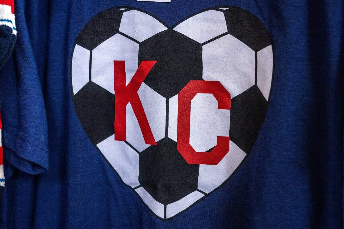 A soccer ball-themed Charlie Hustle shirt is displayed for sale at Rally House inside Union Station on Tuesday, June 9, 2026, in Kansas City.