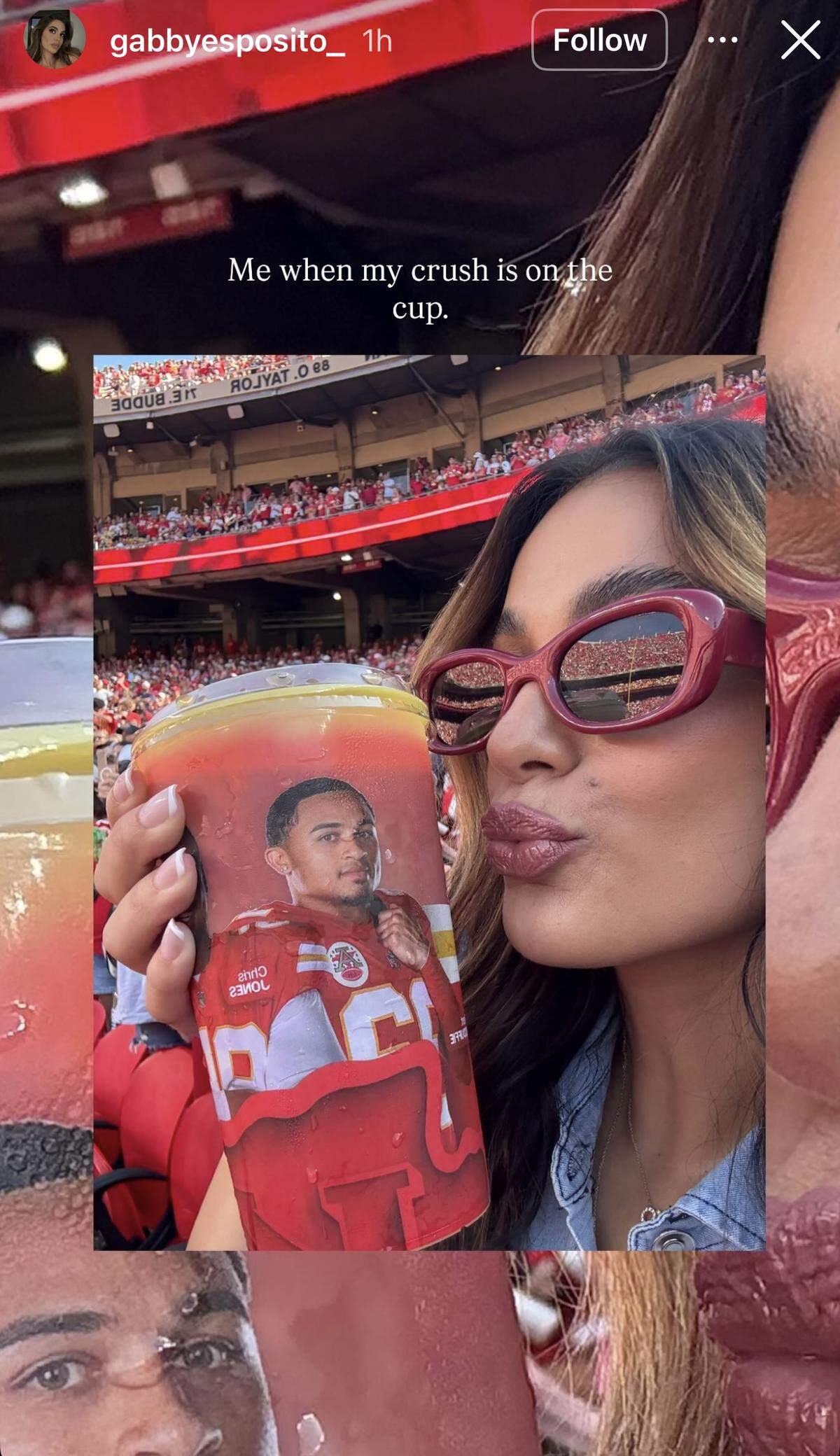 Gabby Esposito shows off Trend McDuffie’s stadium cup.