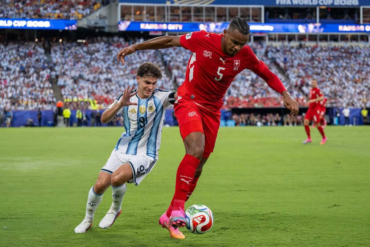 Switzerland defender Manuel Akanji (5) kicks a ball away from Argentina forward Julián Álvarez (9) in a 2026 FIFA World Cup quarterfinal match at Kansas City (Arrowhead) Stadium in Kansas City on Saturday, July 11, 2026.