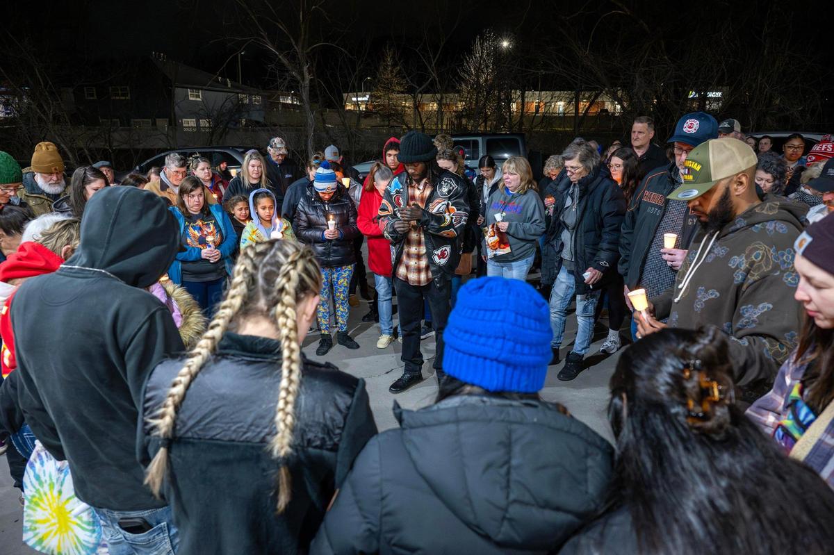 Family and friends of Katherine Bjorklund join in prayer during a vigil for Katherine at Riverside Car Wash on Thursday, March 6, 2025, in Kansas City.