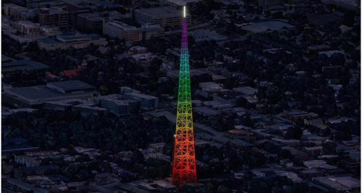 An artistic rendering of the KCTV Tower bathed in colorful LED lighting.