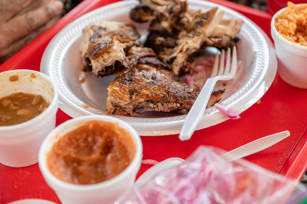On the menu at El Pollo Rey: a pollo medio platter with beans and rice.