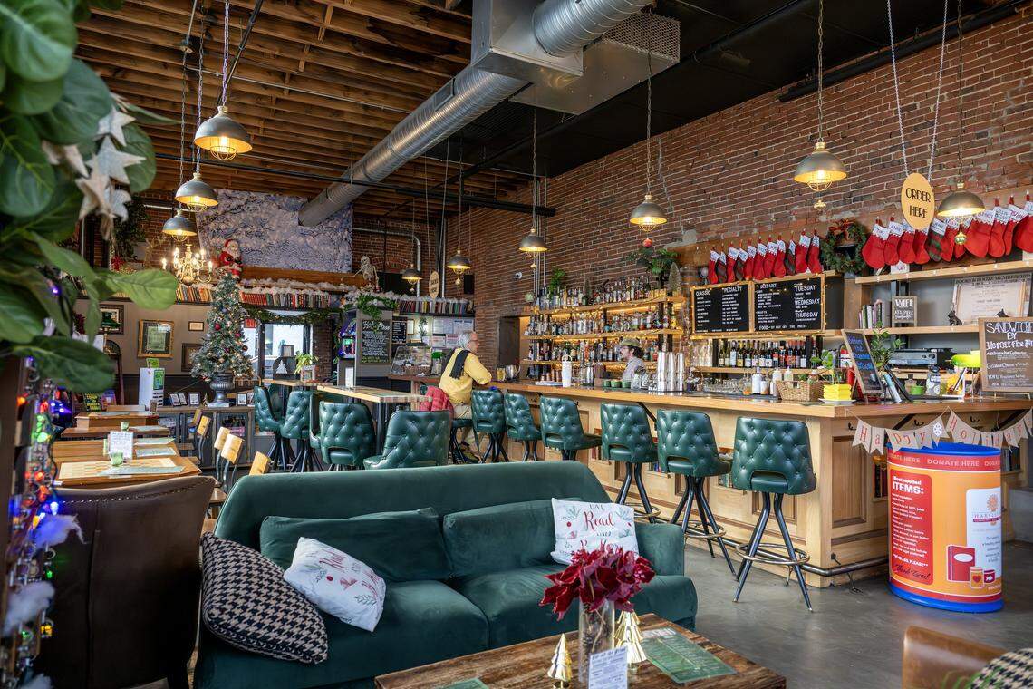 A guest sits at the bar inside Afterword on Wednesday, Dec. 3, 2025, in Kansas City.