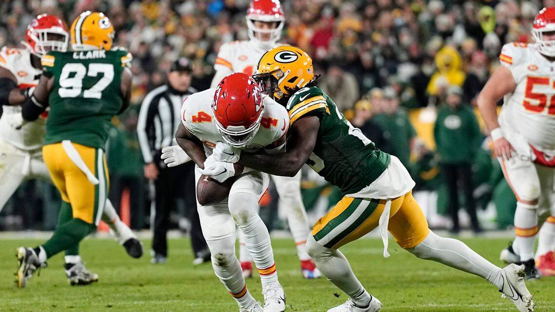 Chiefs wide receiver Rashee Rice, center, catches a pass under pressure from Green Bay Packers safety Darnell Savage during Sunday night’s game at Lambeau Field.