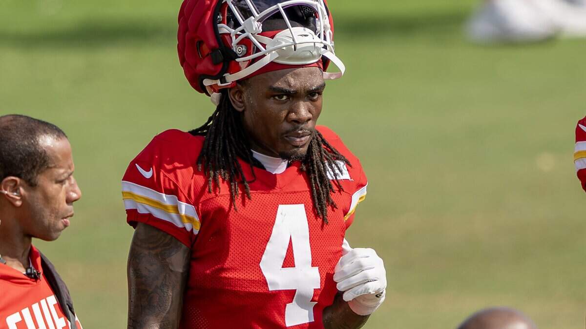 Kansas City Chiefs wide receiver Rashee Rice stands on the sideline during practice at training camp on Tuesday, Aug. 11