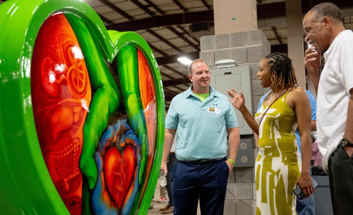 Artist Scott Seetin discusses his heart titled “The Gift of Life” during the Parade of Hearts Reveal Kickoff Event on Friday, April 14, 2023, in Kansas City.