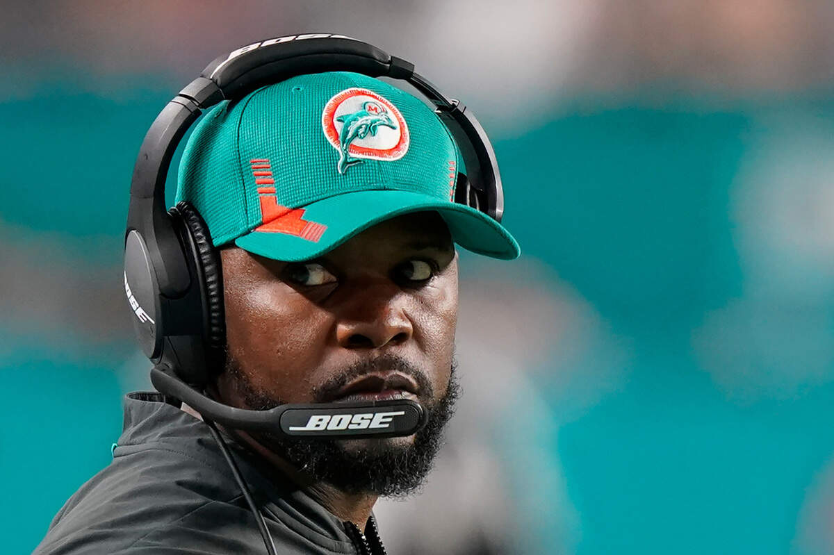 Miami Dolphins head coach Brian Flores during the second half of an NFL football game against the New England Patriots, Sunday, Jan. 9, 2022, in Miami Gardens, Fla. Fired Miami Dolphins Coach Brian Flores sued the NFL and three of its teams Tuesday, Feb. 1, 2022 saying racist hiring practices by the league have left it racially segregated and managed like a plantation. (AP Photo/Wilfredo Lee, File)