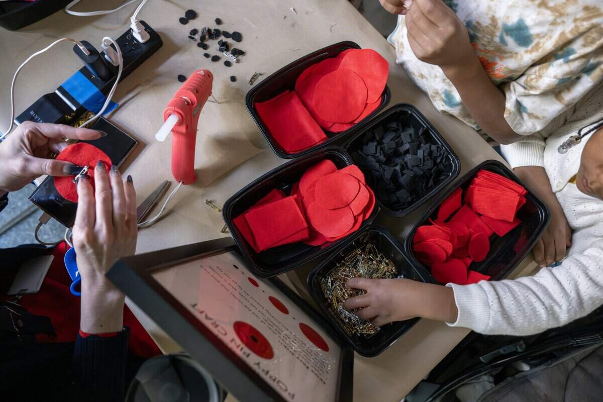 Materials to make felt poppy pins are displayed for visitors to create pins in honor of Veterans Day at the National WWI Museum and Memorial on Tuesday, Nov. 11, 2025.