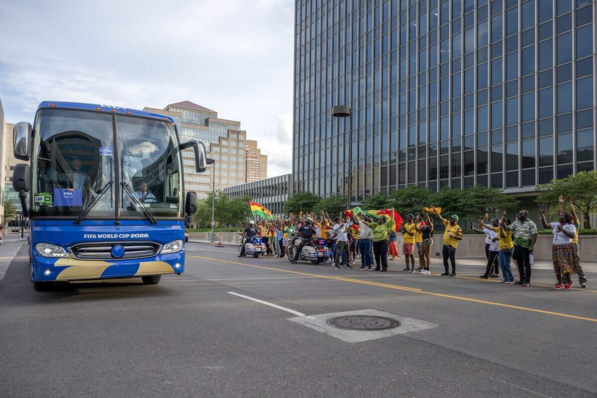 Ghana supporters cheer as the Ghana national team's bus pulls up outside the Sheraton Kansas City Hotel on Wednesday, July 1, 2026.