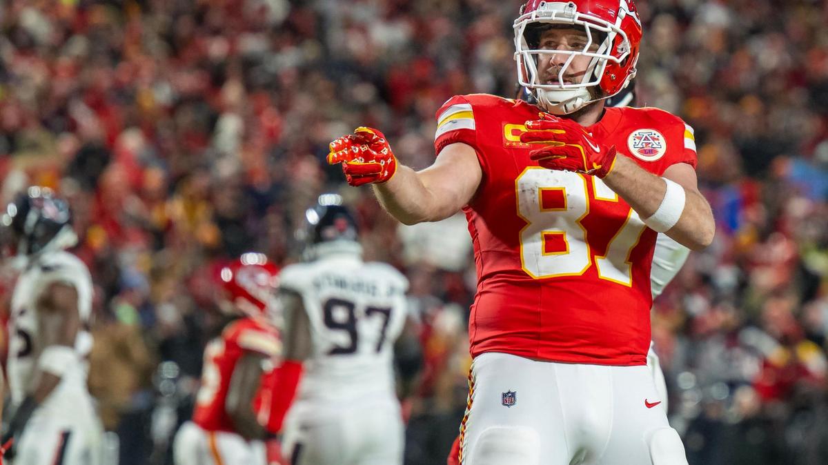 Kansas City Chiefs tight end Travis Kelce (87) gestures for a first down after his run the second half of the AFC Divisional Round playoff game on Saturday, Jan. 18, 2025, at GEHA Field at Arrowhead Stadium. The Chiefs defeated the Texans 23-14.