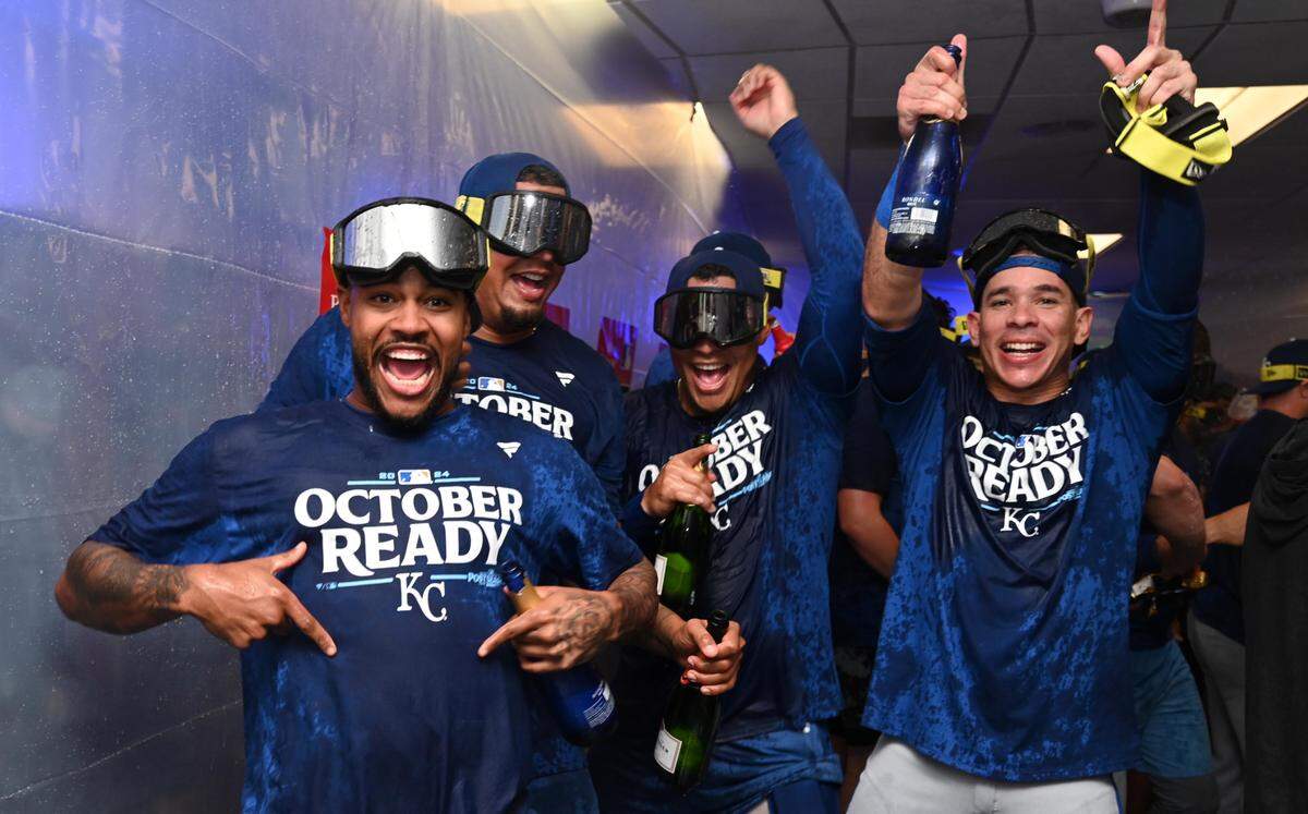 Kansas City Royals players celebrate in the locker room after defeating the Baltimore Orioles in Game 2 of the Wild Card round at Oriole Park at Camden Yards on Oct. 2, 2024.