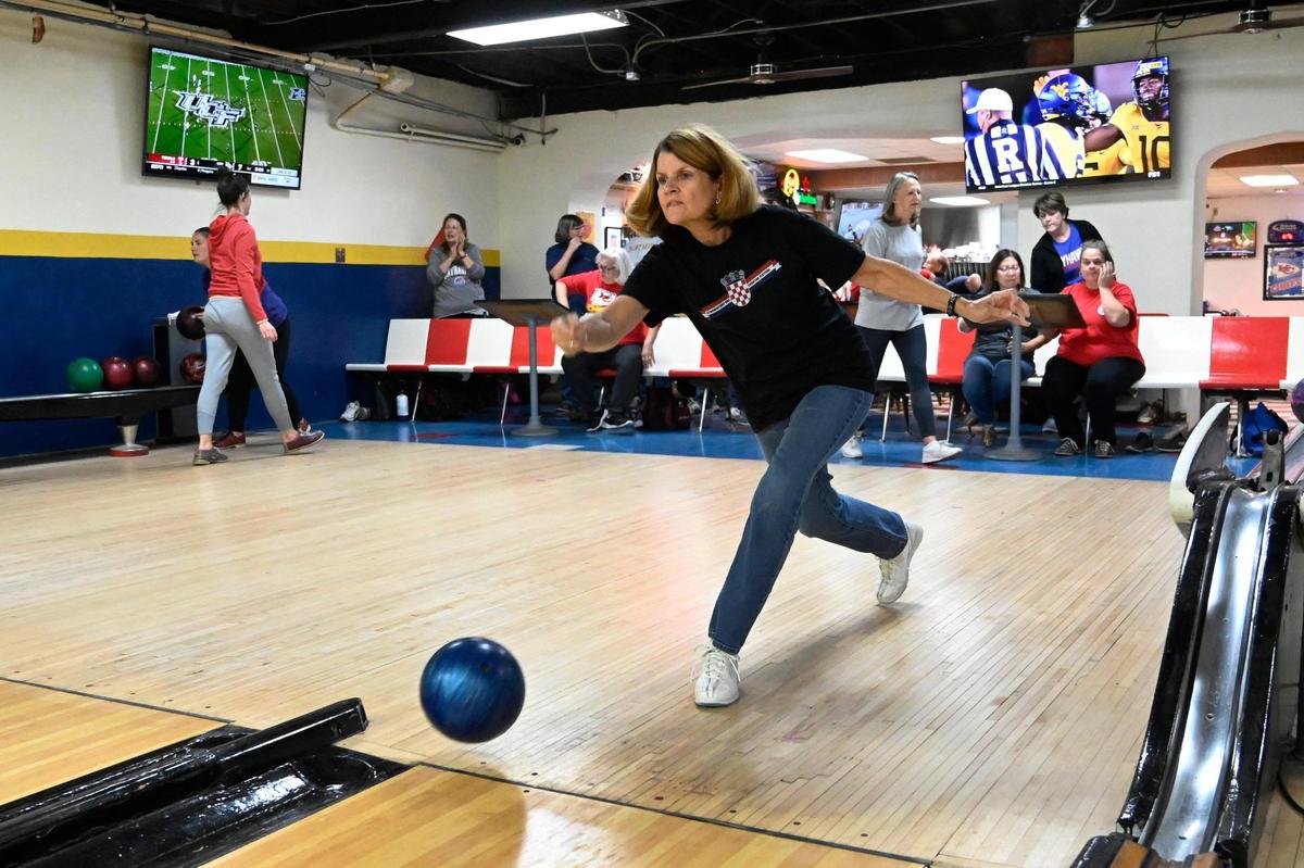 Marie Kolich lets one fly during a women’s league bowling night on a recent Thursday. Kolich has many family members who bowl at the club.