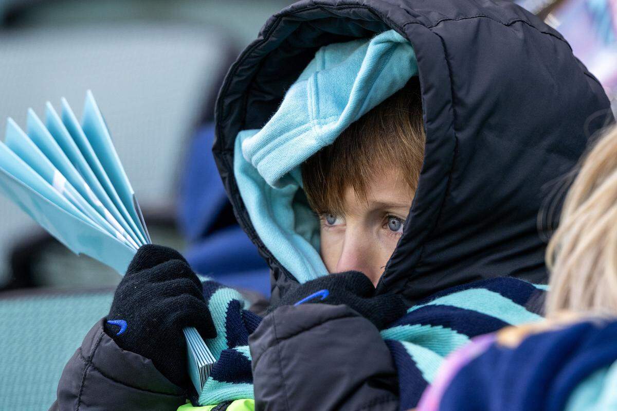 A KC Current fan bundles up to stay warm during an NWSL playoff match between the Current and Gotham at CPKC Stadium in Kansas City on Sunday, Nov. 9, 2025.