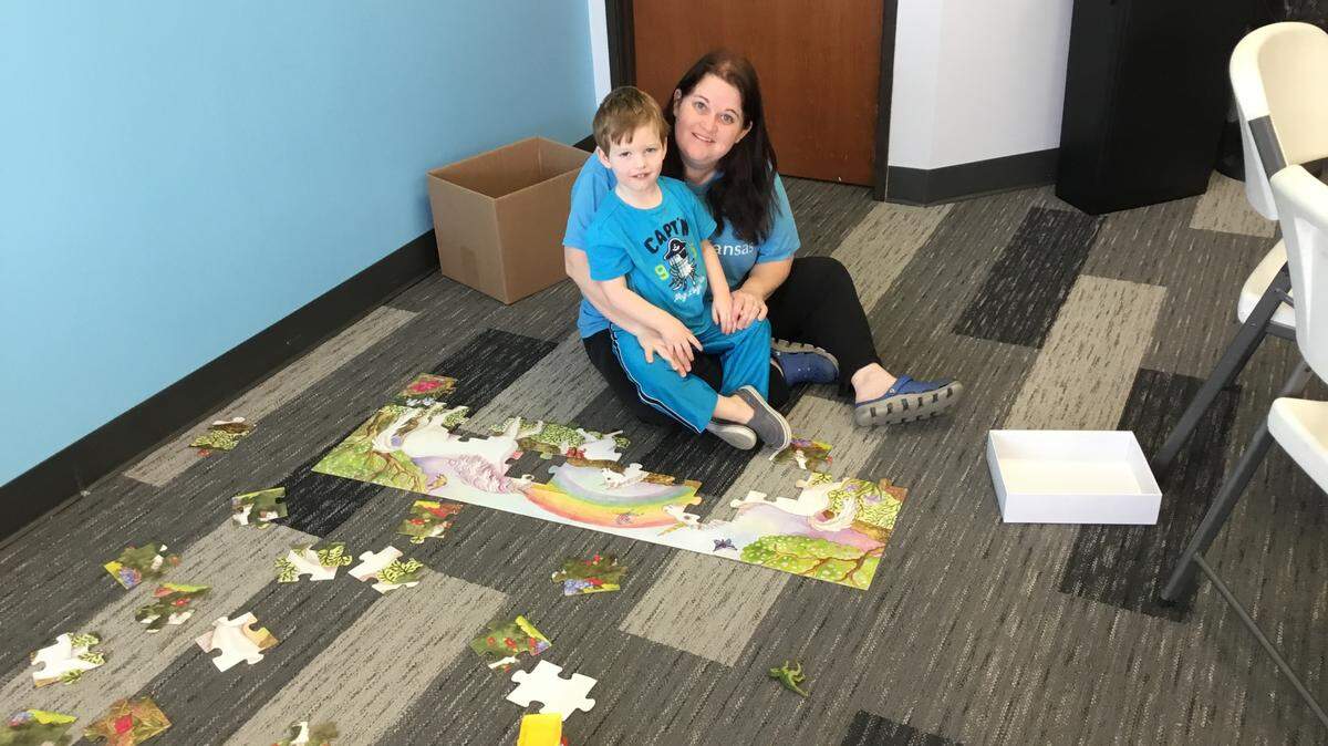 Kathy Hopewell looks after a child from a Project Home family.