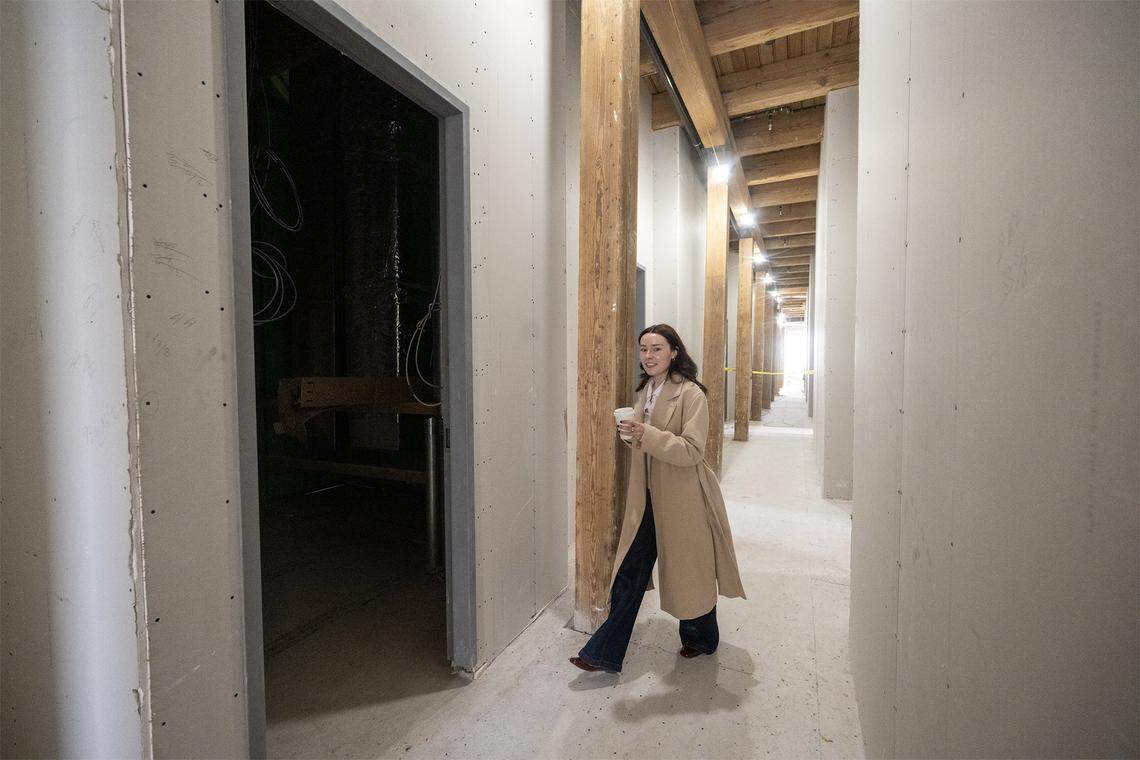 A guest tours the second floor of the new River Market Hotel, 415 Delaware St., in Kansas City. The project, which held a ground breaking ceremony on Tuesday, Dec. 9, 2025, will transform a historic building into a 45-room boutique hotel, with plans to open in the spring of 2026.
