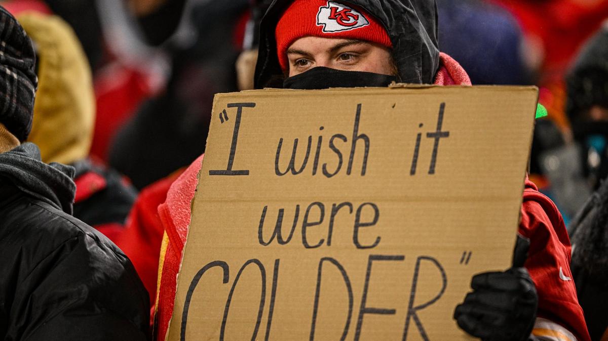 A Kansas City Chiefs fan holds a sign about the cold weather during the AFC Wild Card game against the Miami Dolphins.