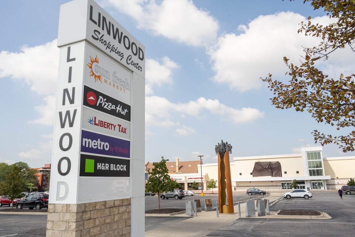 Sun Fresh Linwood with a black tarp covering its logo on Wednesday, Aug. 13, 2025, in Kansas City. The troubled grocery store closed the previous day.