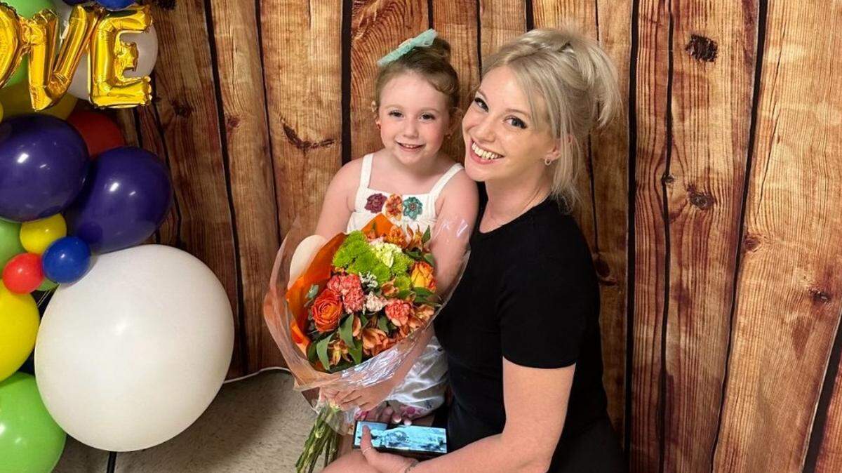 Courtney Wickman poses with her 4-year-old daughter Lana after her dance recital. Wickman died in October after a stray bullet struck her in the head during a night out to celebrate her birthday in Kansas City.