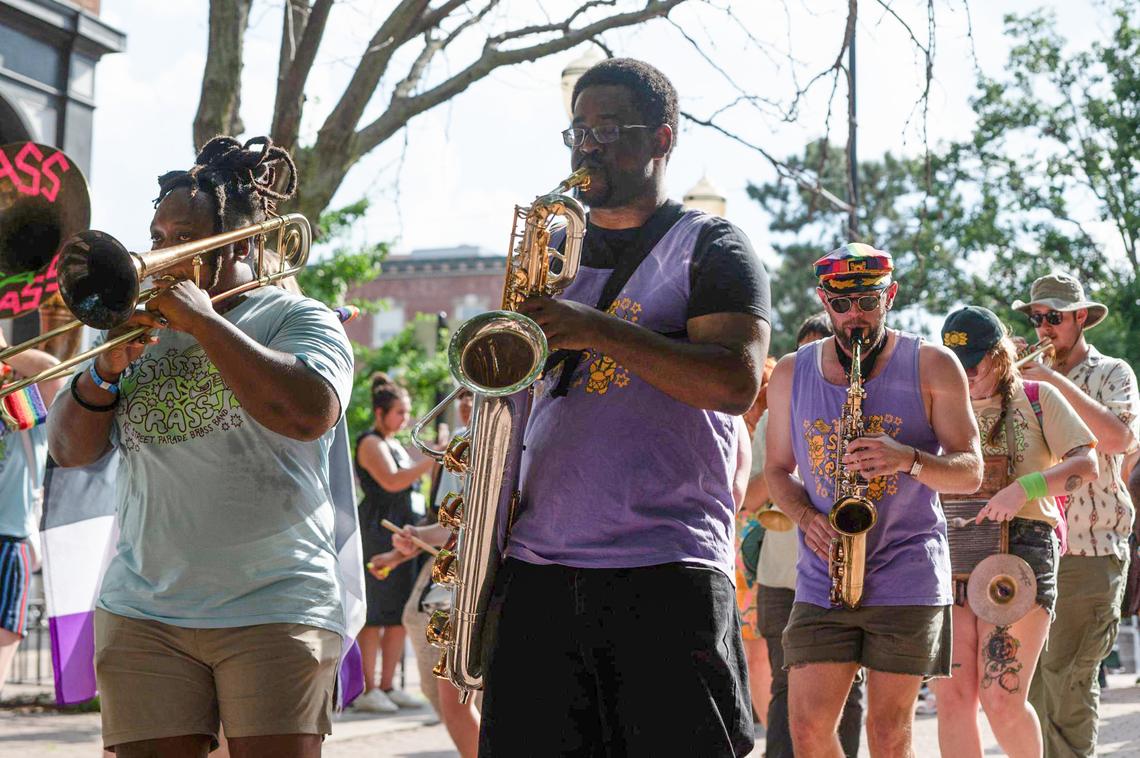 Sass-A-Brass band members march and play during the City Market Pride month celebration in Kansas City.