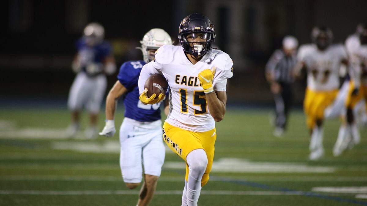 Liberty North’s Keelan Smith breaks away from the Rockhurst defense for a 68-yard touchdown on Friday night.