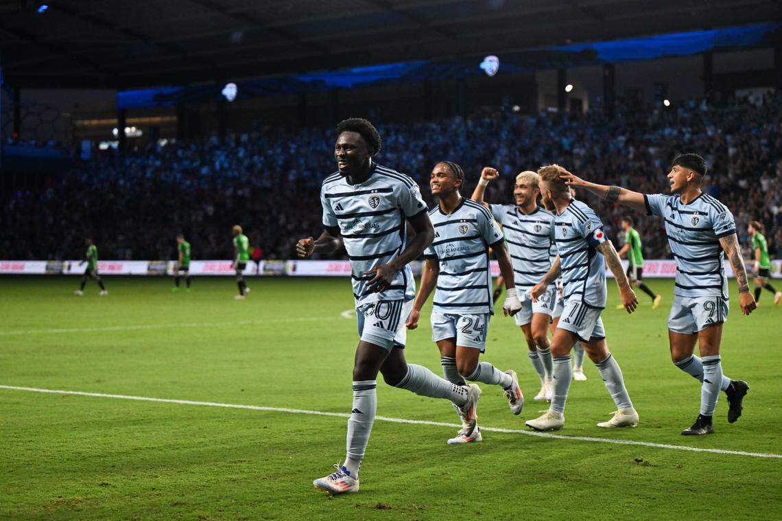 Sporting Kansas City forward Stephen Afrifa, left, celebrates after scoring in the second half of Saturday evening’s MLS match against Austin FC at Children’s Mercy Park in Kansas City, Kan.
