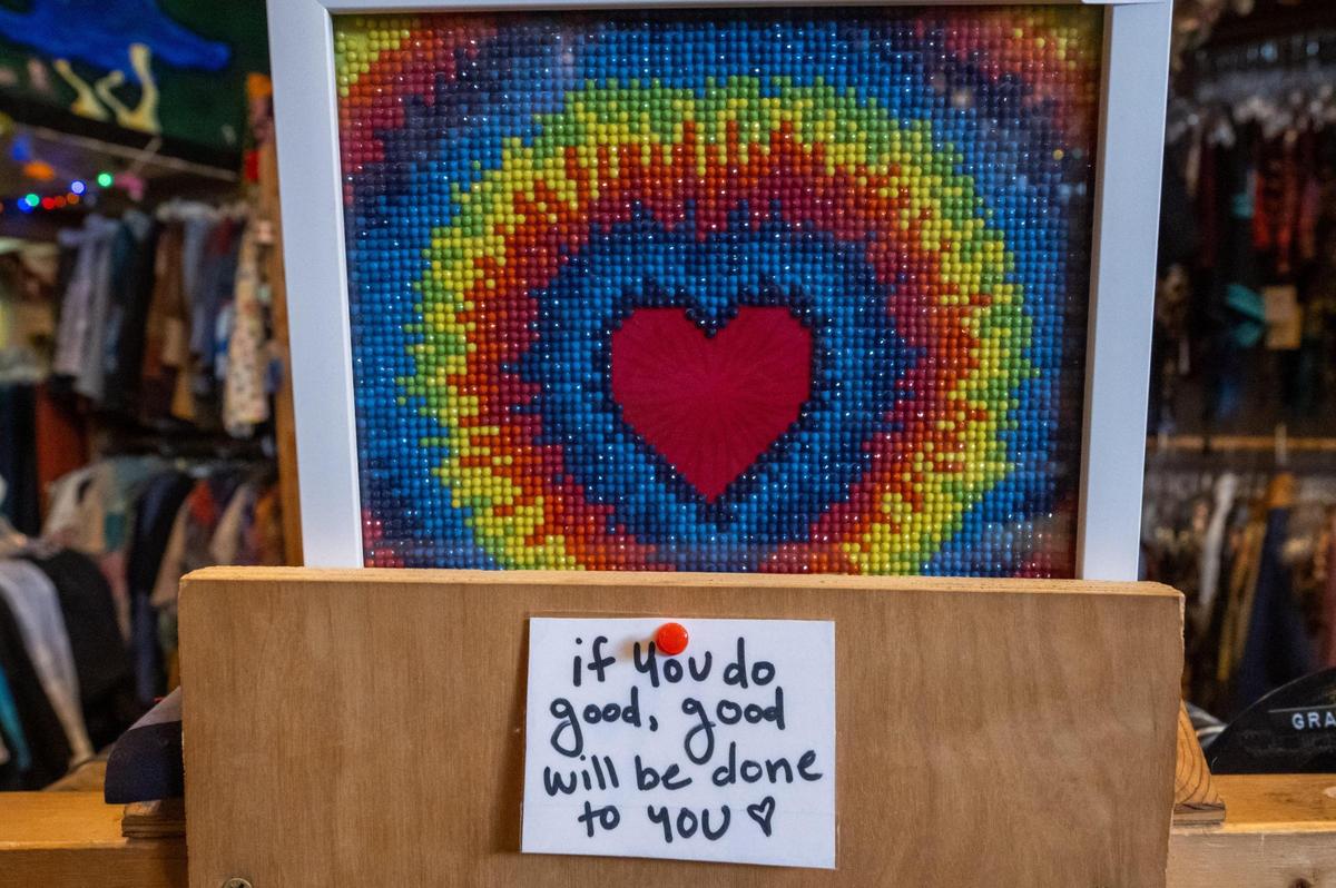 A note at It’s a Beautiful Day wishes visitors good vibes. The shop is covered from top to bottom with hippie memorabilia and references to classic bands and aliens.