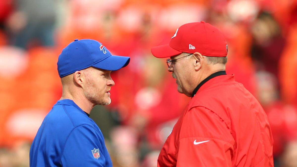 Buffalo Bills head coach Sean McDermott talks with Kansas City Chiefs head coach Andy Reid before a game at GEHA Field at Arrowhead Stadium.
