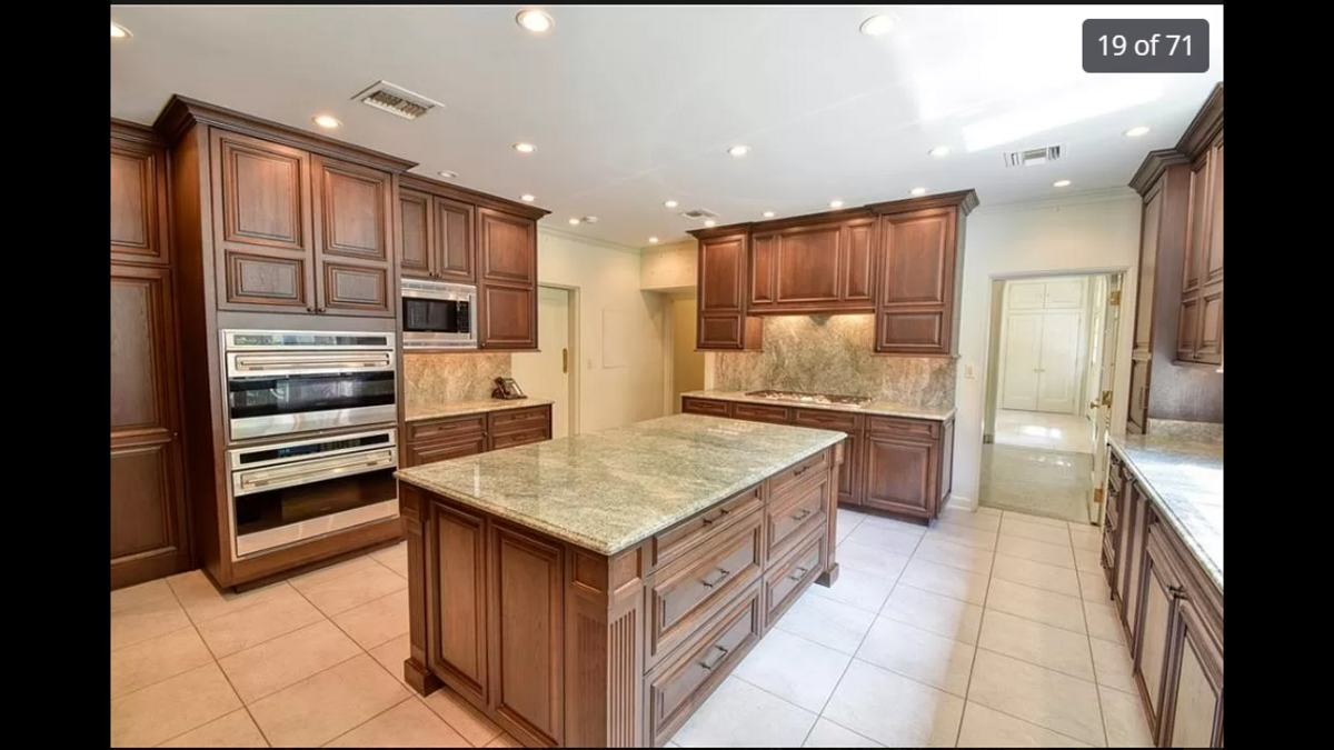 A look at the kitchen island and two full ovens inside 1228 W. 56th St. in Kansas City.