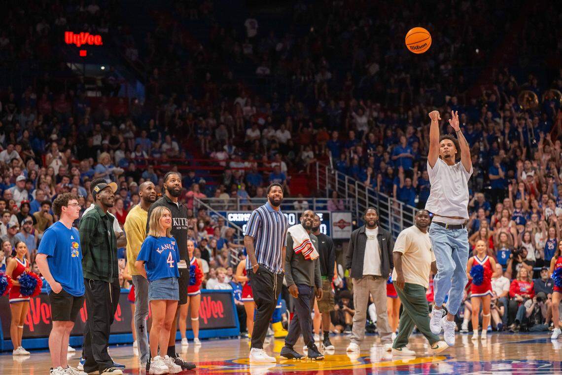 Former Kansas Jayhawks guard Zeke Mayo takes a half-court shot to win a prize for a fan during Late Night in the Phog, on Friday, October 17, 2025, in Lawrence.