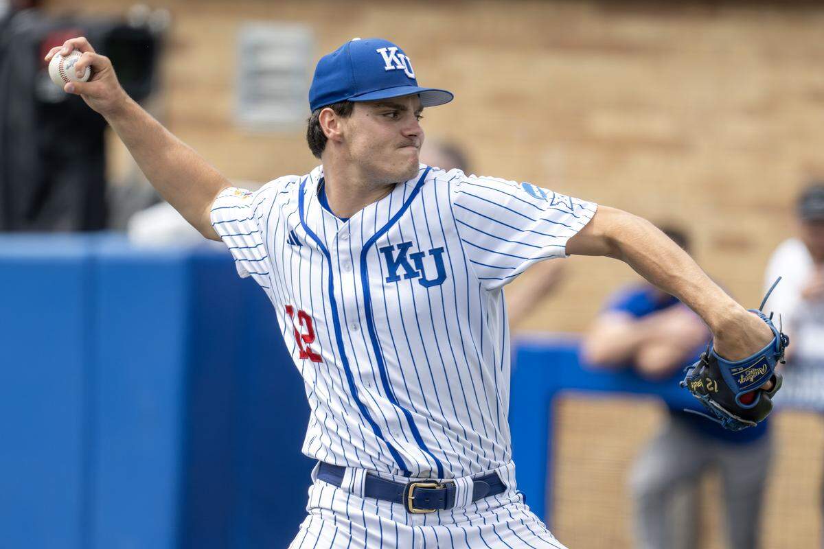 Kansas Jayhawks pitcher Dominic Voegele (12) throws in the first inning against the Northeastern Huskies during an NCAA baseball tournament game at Hoglund Ballpark on Friday, May 29, 2026, in Lawrence.