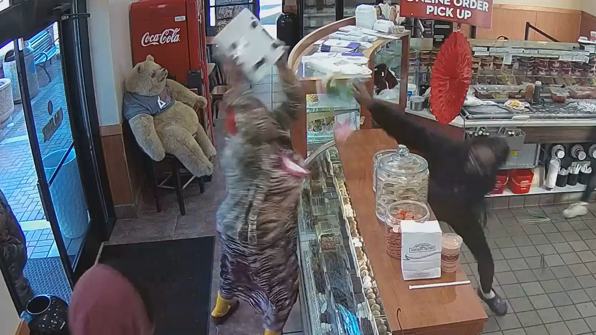 Authorities in Michigan say a customer of Cold Stone Creamery threw a food scale at a worker while she was upset about her ice cream.