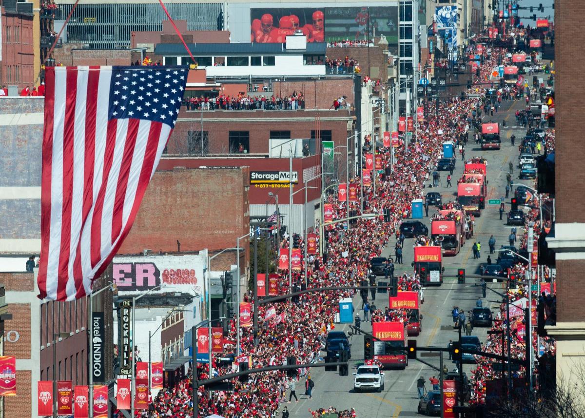 Buses loaded with Chiefs players and staff roll down Grand Boulevard during the Kansas City Chiefs Super Bowl LVIII victory parade Wednesday, Feb. 14, 2024, in Kansas City.