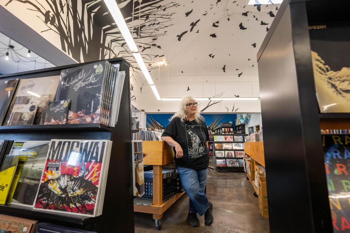 Judy Mills, owner of Mills Record Company in her shop on Friday, April 11, 2025, the day before Record Store Day, the biggest day of the year for small record stores like hers. The day brings music fans together for exclusive releases and giveaways.