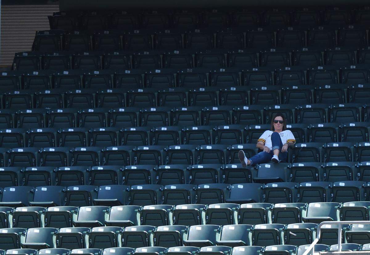 A lone fan in the stands.