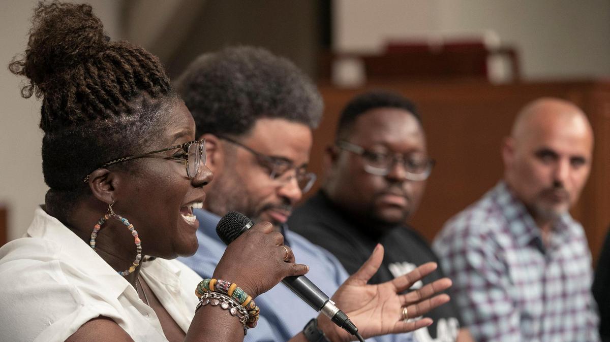 Lakiesha Moore, left, joined a panel Saturday at a forum at Community Christian Church to talk about racism.