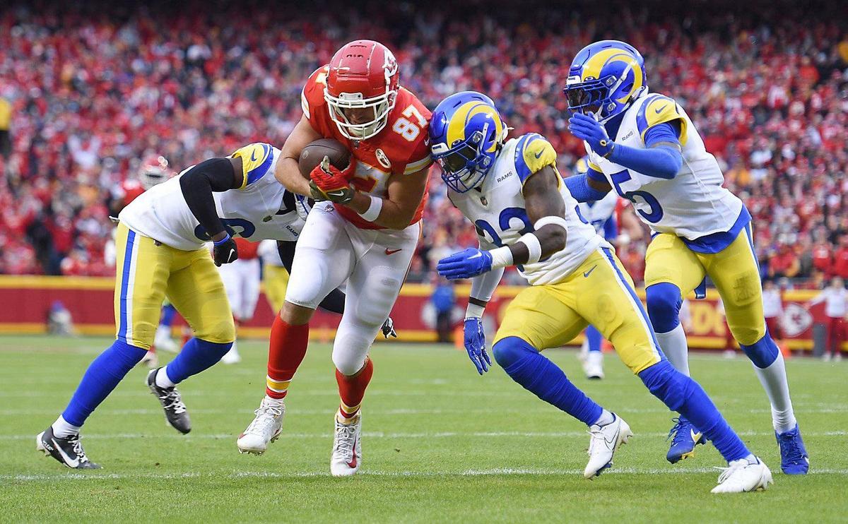 Kansas City Chiefs tight end Travis Kelce heads for the end zone for a touchdown in the first quarter despite plenty of Los Angeles Rams defenders there attempting to stop him Sunday, Nov. 27, 2022, at Arrowhead Stadium.