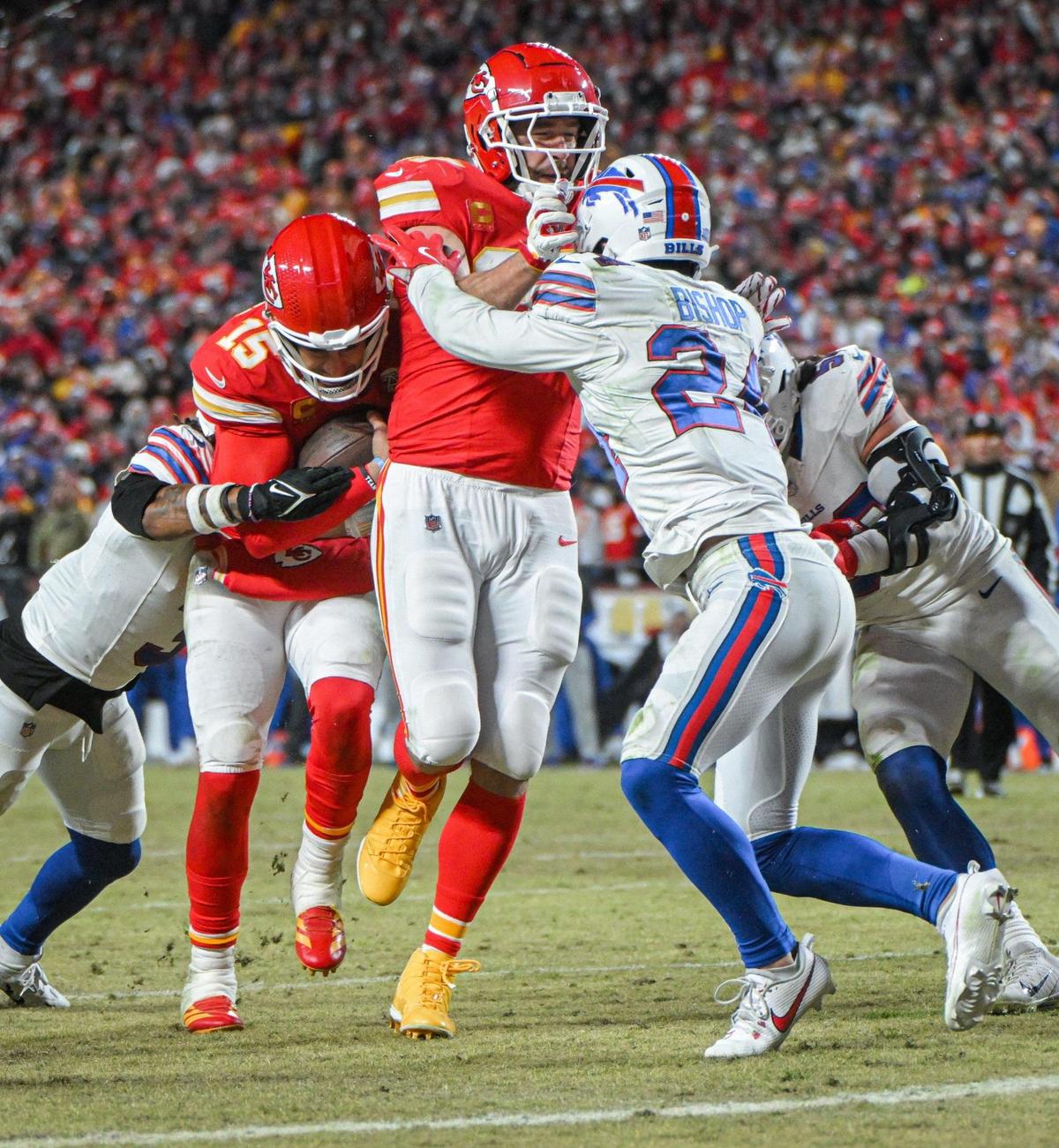 Kansas City Chiefs tight end Travis Kelce (87) blocks Buffalo Bills safety Cole Bishop (24) so quarterback Patrick Mahomes (15) can run in for a touchdown in the fourth quarter during the AFC Championship Game on Sunday, Jan. 26, 2025, at GEHA Field at Arrowhead Stadium.