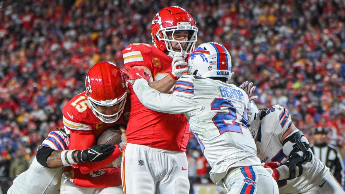 Kansas City Chiefs tight end Travis Kelce (87) blocks Buffalo Bills safety Cole Bishop (24) so quarterback Patrick Mahomes (15) can run in for a touchdown in the fourth quarter during the AFC Championship Game on Sunday, Jan. 26, 2025, at GEHA Field at Arrowhead Stadium.