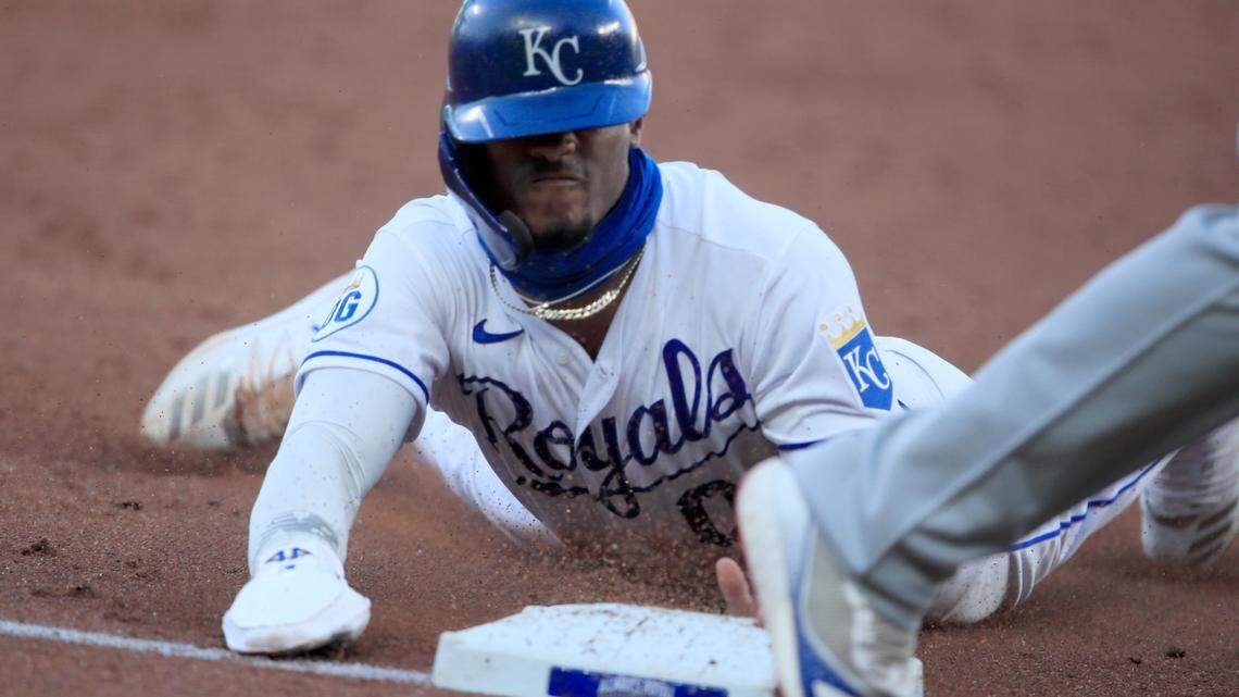 Kansas City Royals Nick Heath (0) steals third base during a double steal in the third inning of a baseball game against the Chicago Cubs at Kauffman Stadium in Kansas City, Mo., Thursday, Aug. 6, 2020. (AP Photo/Orlin Wagner)