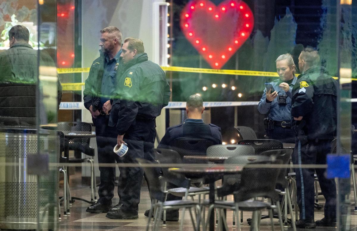 Police work the scene of a shooting at Crown Center on Wednesday, Jan. 17, 2024, in Kansas City, Missouri. Police say six people were injured in the shooting that witnesses say started with an altercation between two groups of people described to be in the late teens or early 20s